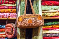 fabric-handbag-sale-shop-muttrah-souk-mutrah-muscat-oman-middle-east-assorted-colorful-fabrics-display-52681136