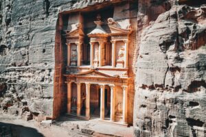 The iconic Treasury in Petra, Jordan, carved into striking sandstone cliffs, captures ancient Nabatean beauty.
