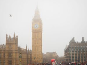 WTM - World Travel Market 2026 Iconic Big Ben tower enveloped in fog with bustling London street scene.
