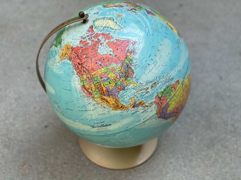 Vintage globe displaying North America and surrounding regions, ideal for geography concepts.