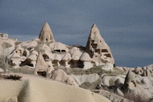 Explore the stunning rock formations and fairy chimneys in Cappadocia, Turkey's natural wonder.
